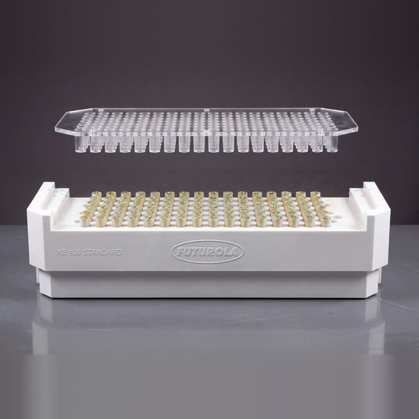 Futurola Dutch Crown Device (KB 100 Standard) with 100 filled cones sunk in, about 10 mm of kraft paper tip showing, crown plate above