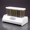 Futurola Knockbox 100 from a raised three-quarter angle, full rack of 100 palm leaf cones under the top plate