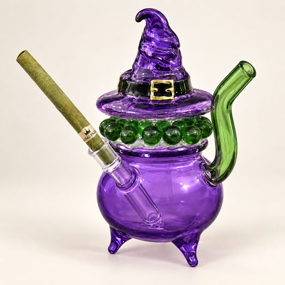 King Palm Witches Puff bubbler with a King Palm roll loaded in the glass tip